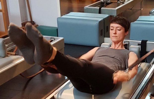 Christine Bowen demonstrating a reformer exercise